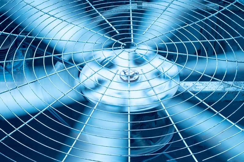 spinning air conditioner fan close-up.